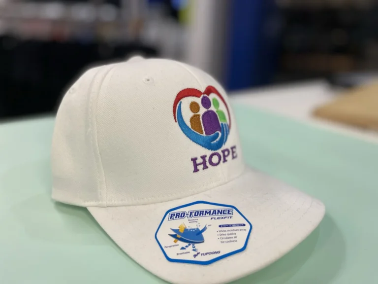 White cap with a colorful HOPE logo