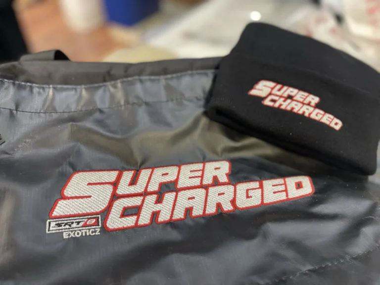 Gray fabric and black beanie with matching Super Charged lettering