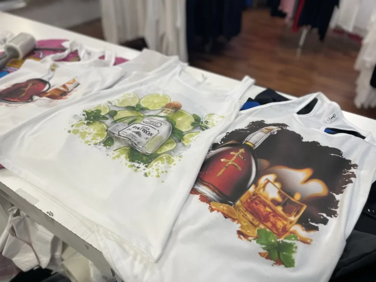 White tank tops with colorful illustrated bottle designs