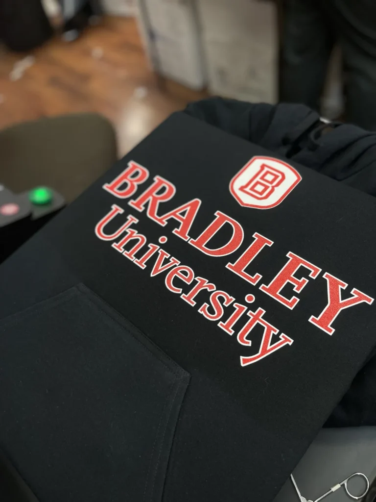 Black hoodie with a red and white Bradley University design