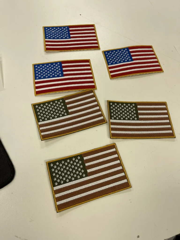 Six US flag patches in traditional and muted colors